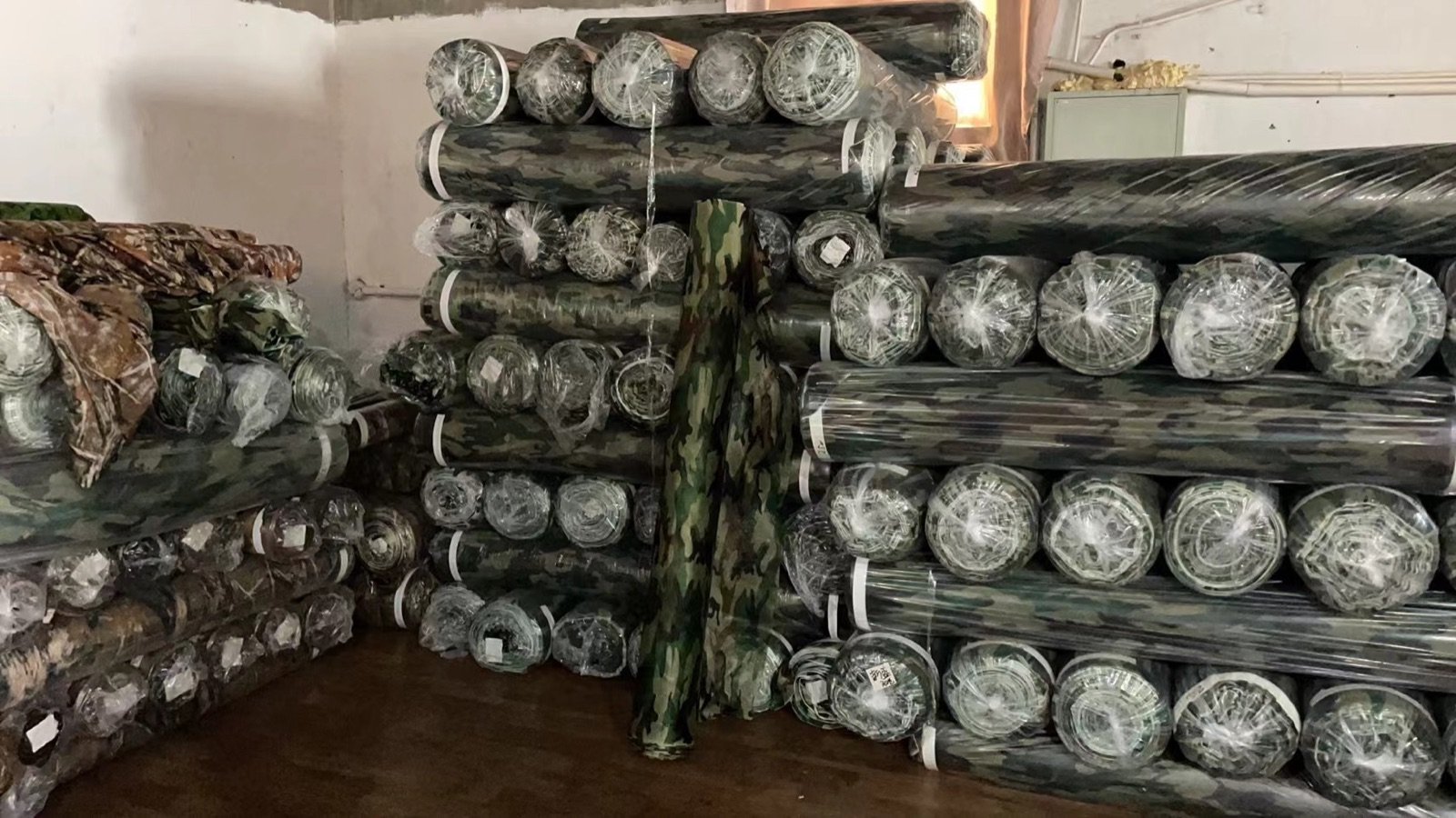 Camouflage fabric rolls in storage